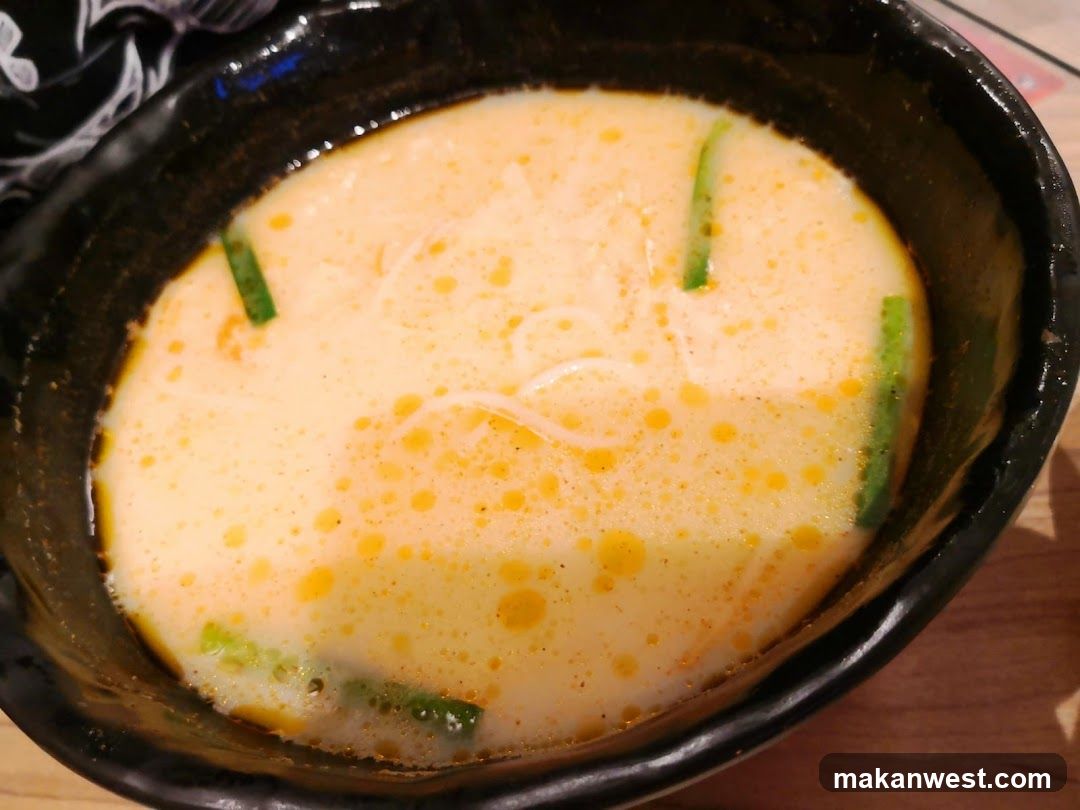 Bowl of creamy soup with green garnish