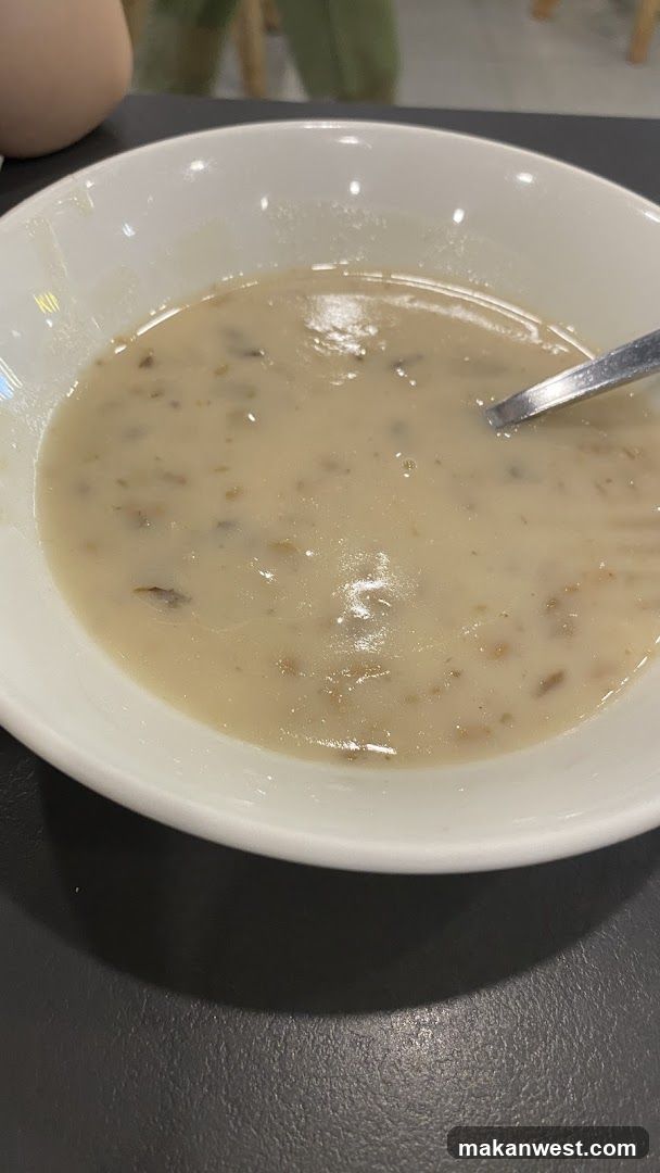 Bowl of creamy soup with spoon