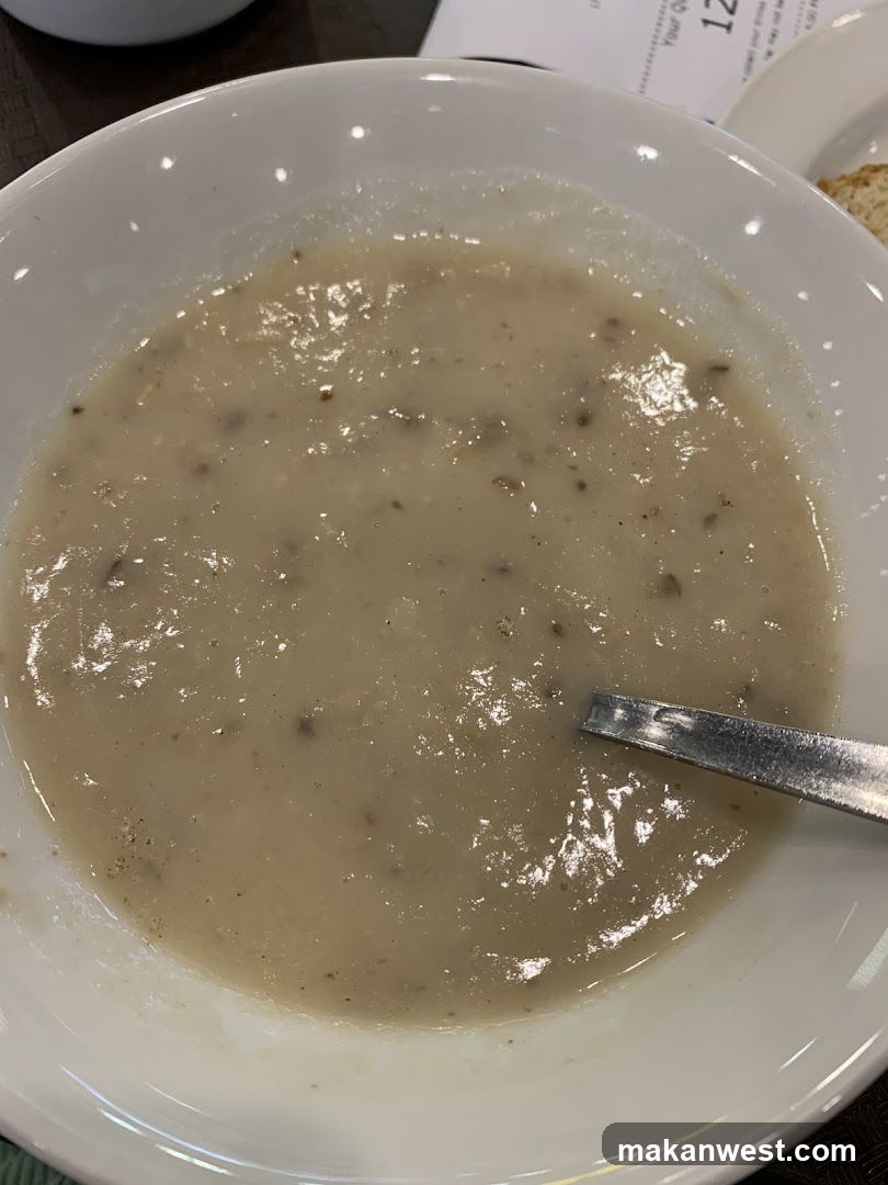 Bowl of creamy soup with spoon