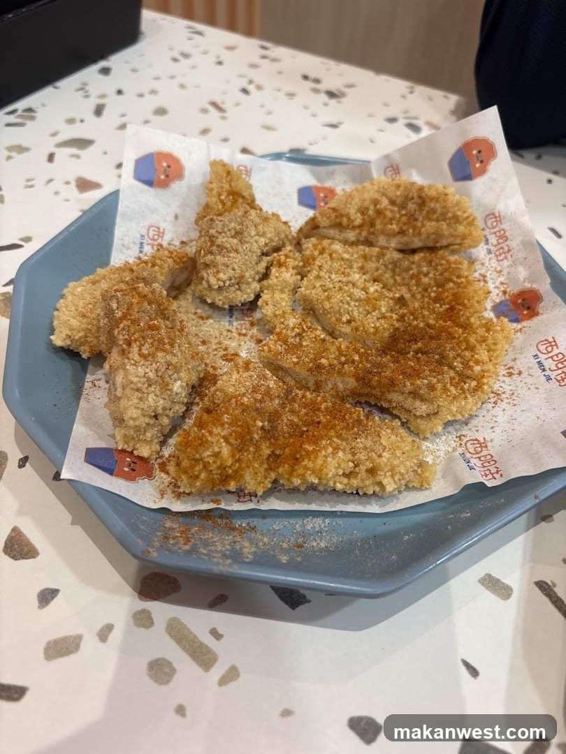 Breaded Chicken Pieces on a Blue Plate