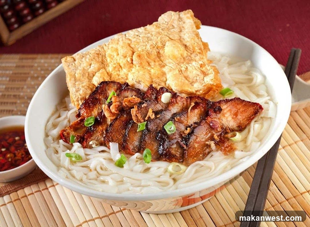 Bowl of Noodles with Roasted Pork and Fried Dough