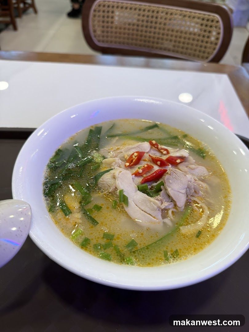 Bowl of Chicken Soup with Chili and Greens