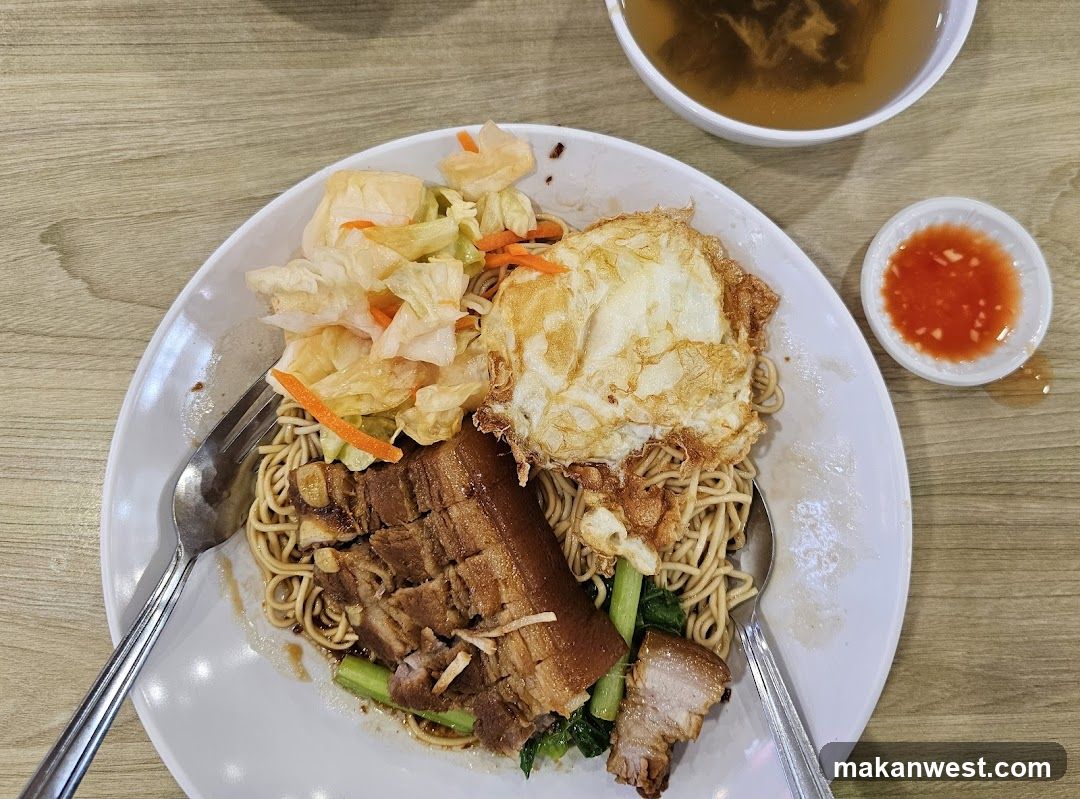 Noodle Dish with Fried Egg and Pork