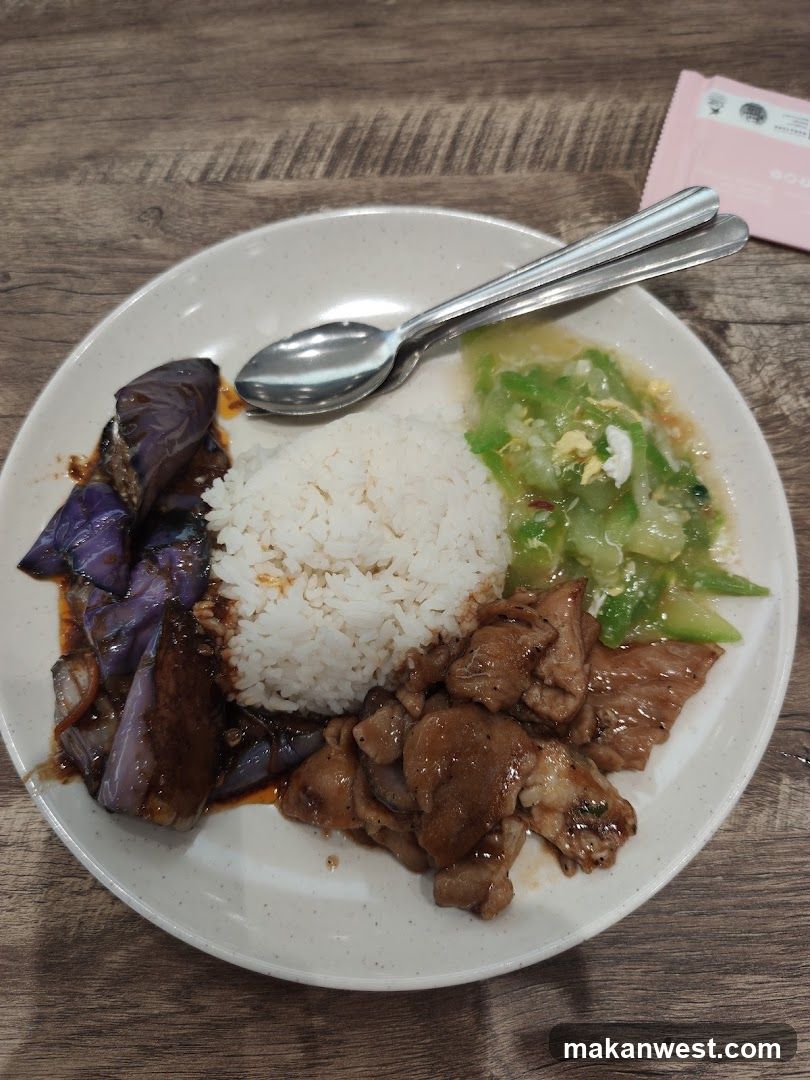 Plate of Food with Rice, Meat, Eggplant and Greens