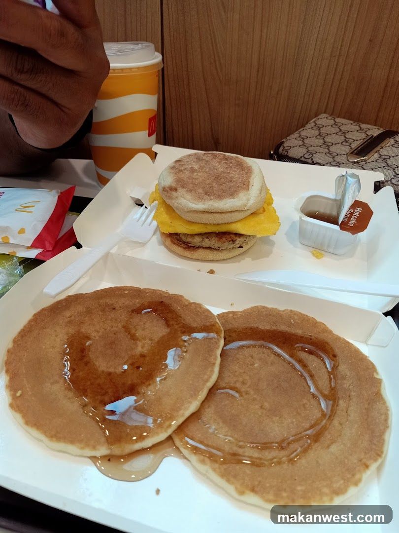 Breakfast Meal with Pancakes and English Muffin Sandwich