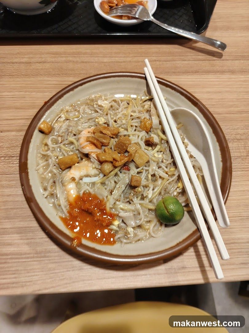 Noodle Dish with Chopsticks and Spoon