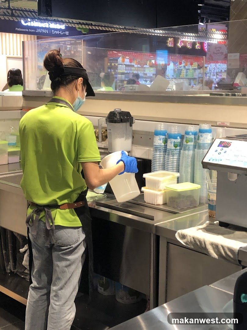 Staff preparing food in a kitchen area