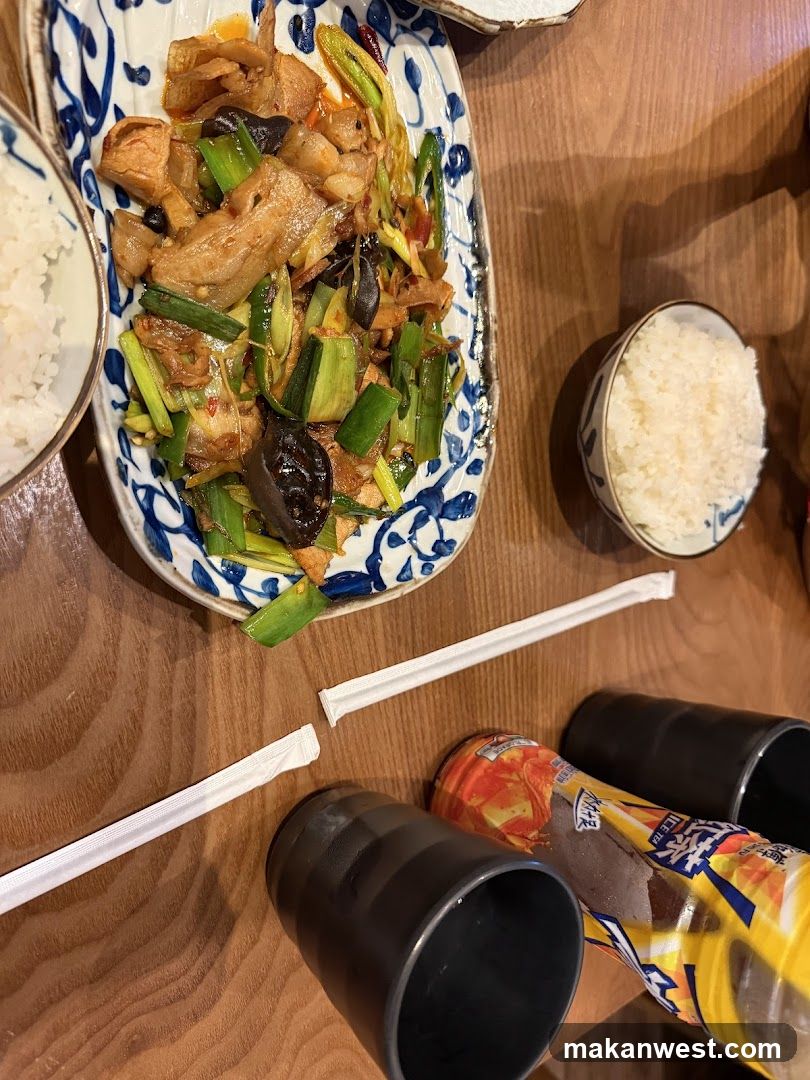 Chinese-style stir-fry with rice and drinks