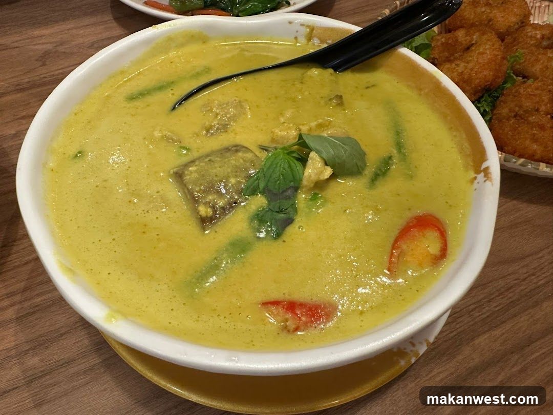 Yellow Curry Soup with Basil and Tomatoes