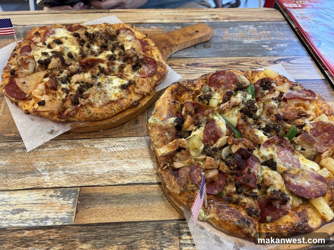 Two Pizzas on Wooden Boards