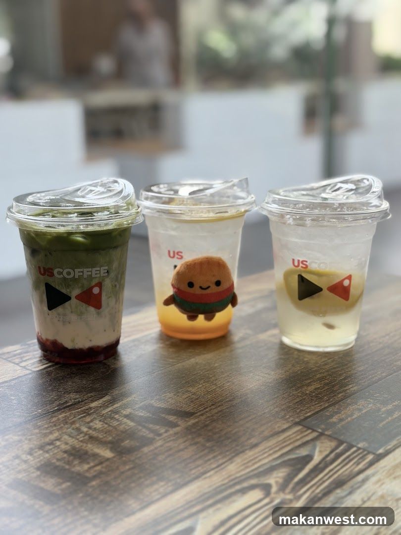Three US Coffee Drinks on a Wooden Table