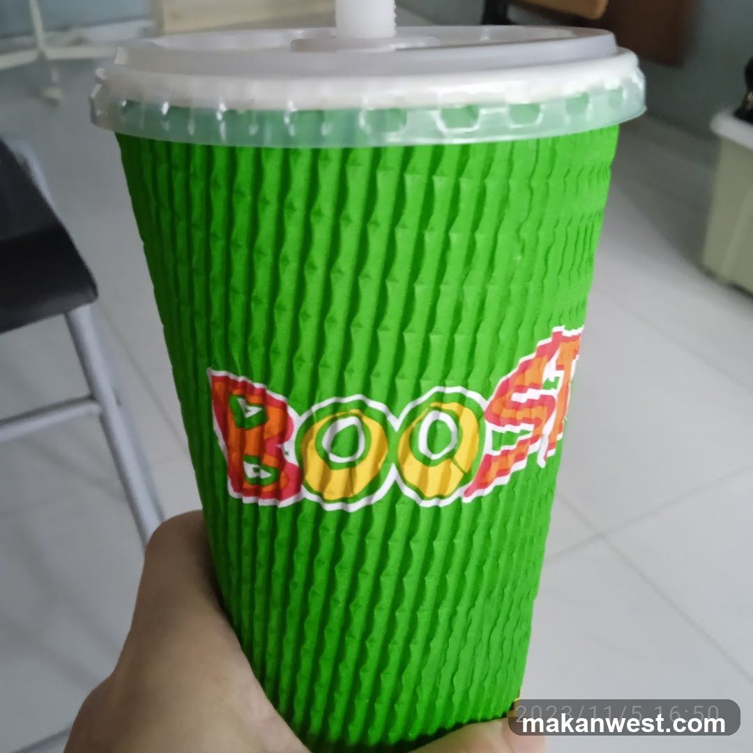 Green cup with BOOST logo