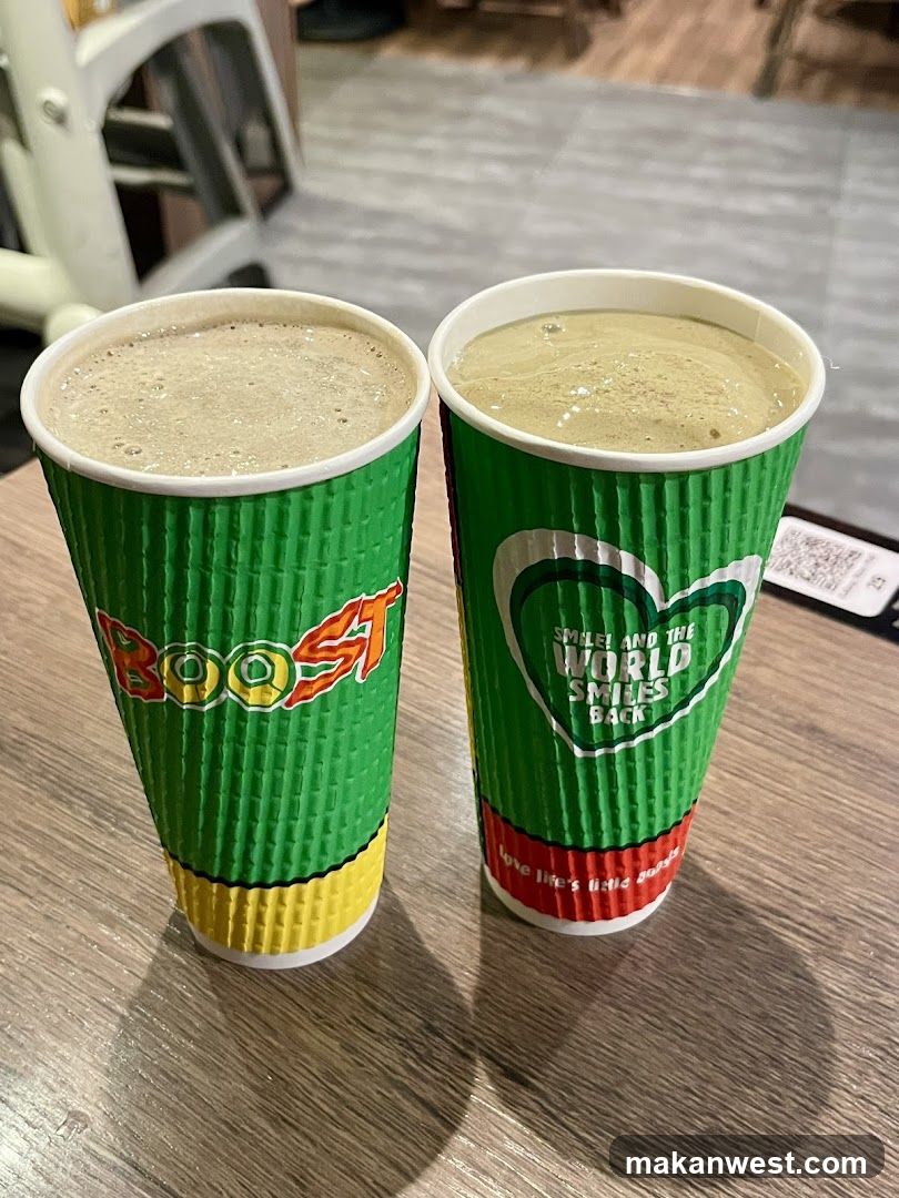 Two green cups with beverages on a table