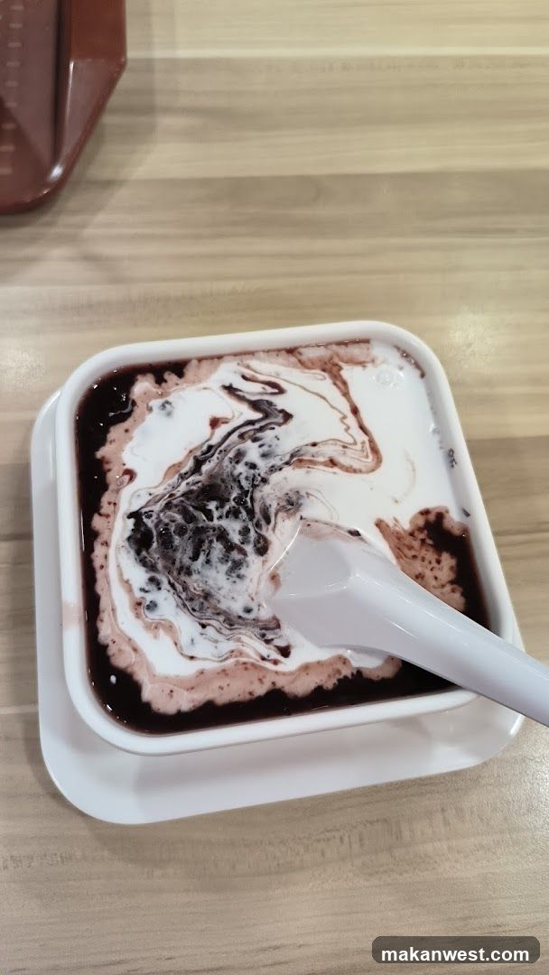 Bowl of Dessert with Cream and Syrup
