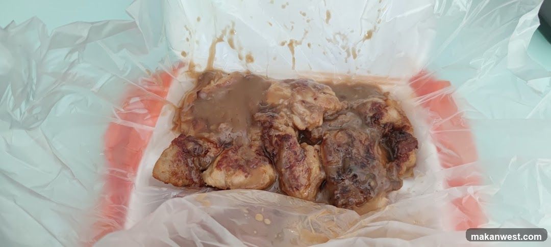 Sauced Chicken Pieces in Plastic Container