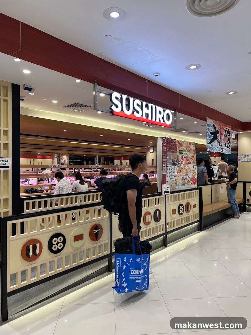 Sushi restaurant interior with customers