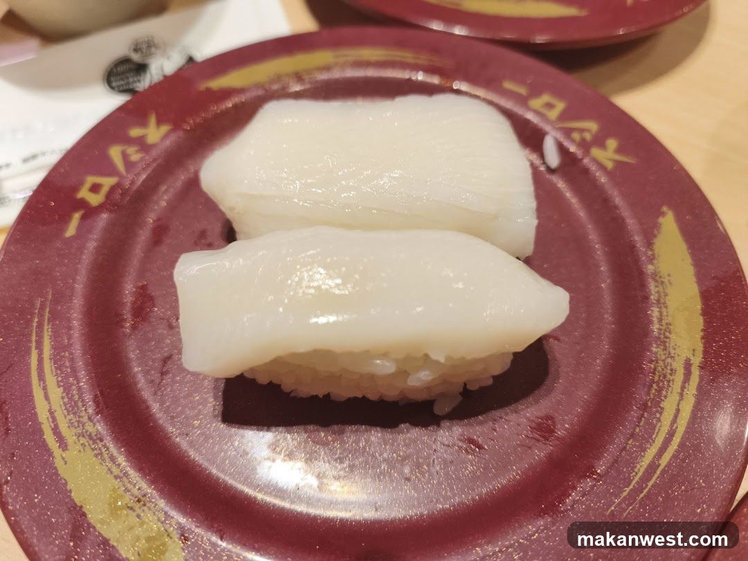Sushi on a conveyor belt plate