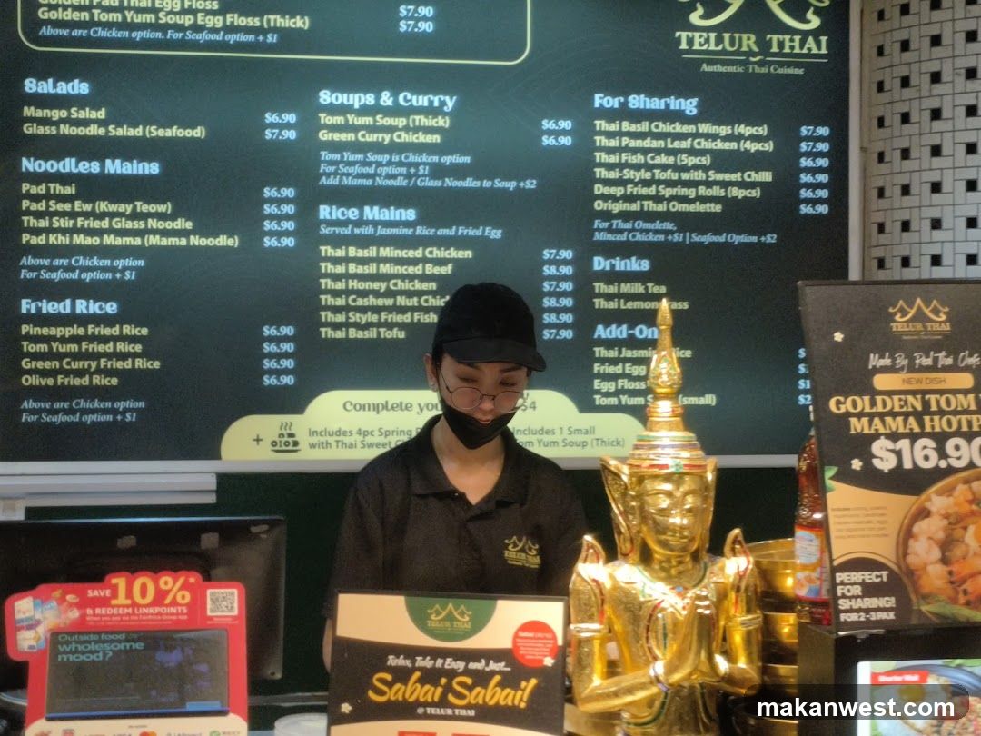 Thai Restaurant Interior with Staff and Decor