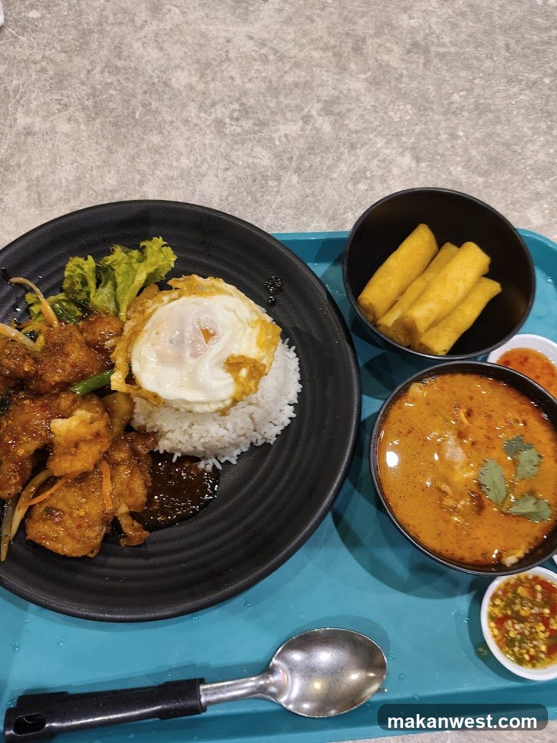 Thai Curry Meal with Fried Egg and Spring Rolls