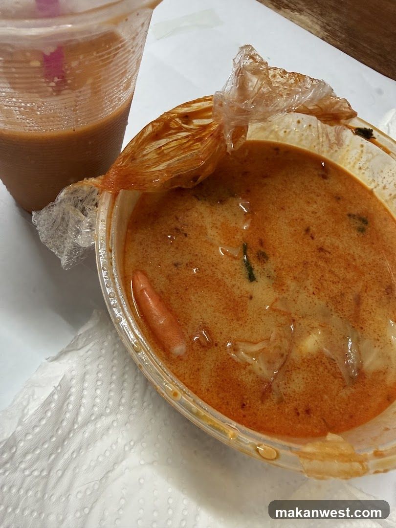 Takeout Meal with Curry Soup and Drink