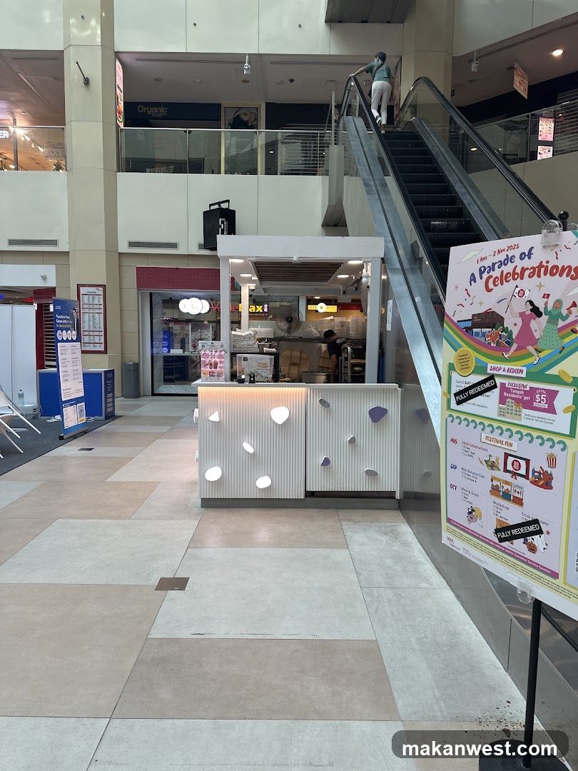 Shopping Mall Interior with Food Stall and Event Signage