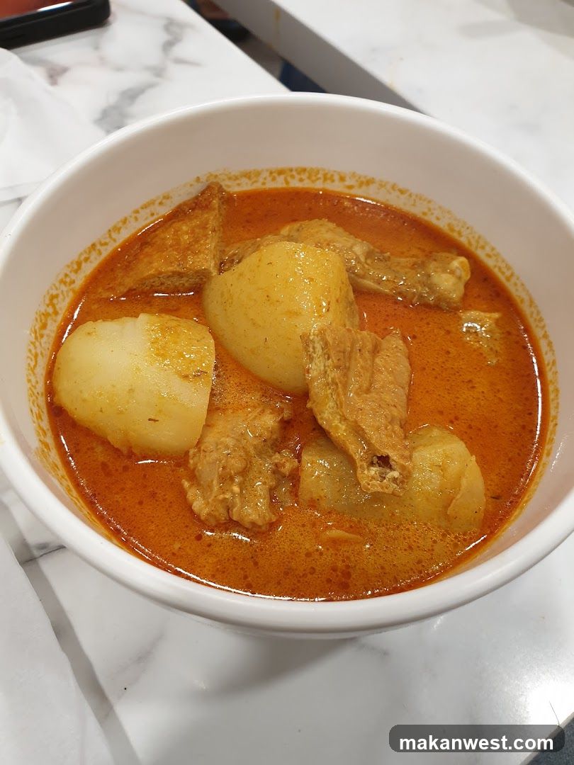 Bowl of Curry with Potatoes and Meat