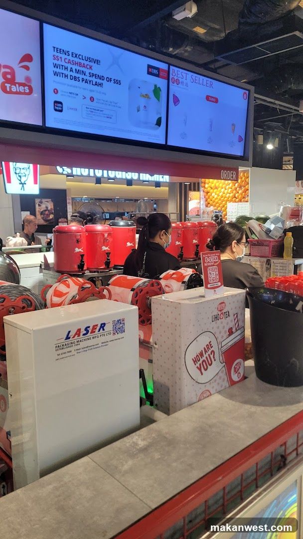 Food Court Interior with Digital Screens and Staff
