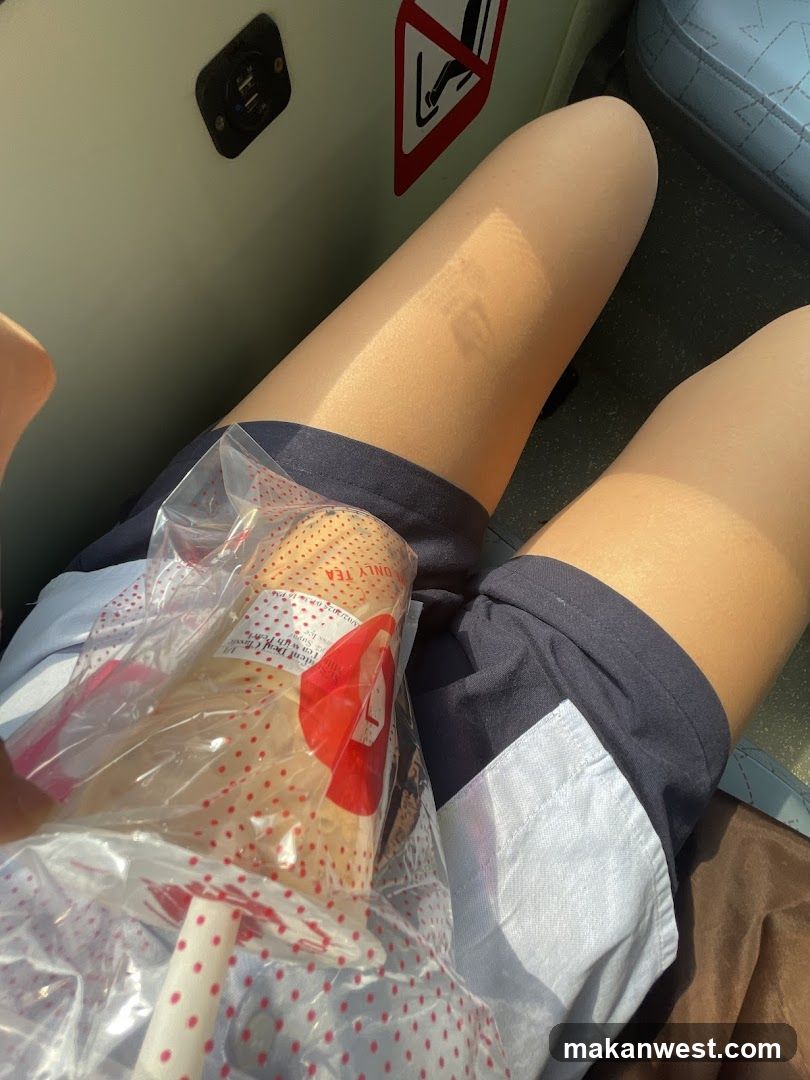 Beverage in plastic bag on lap