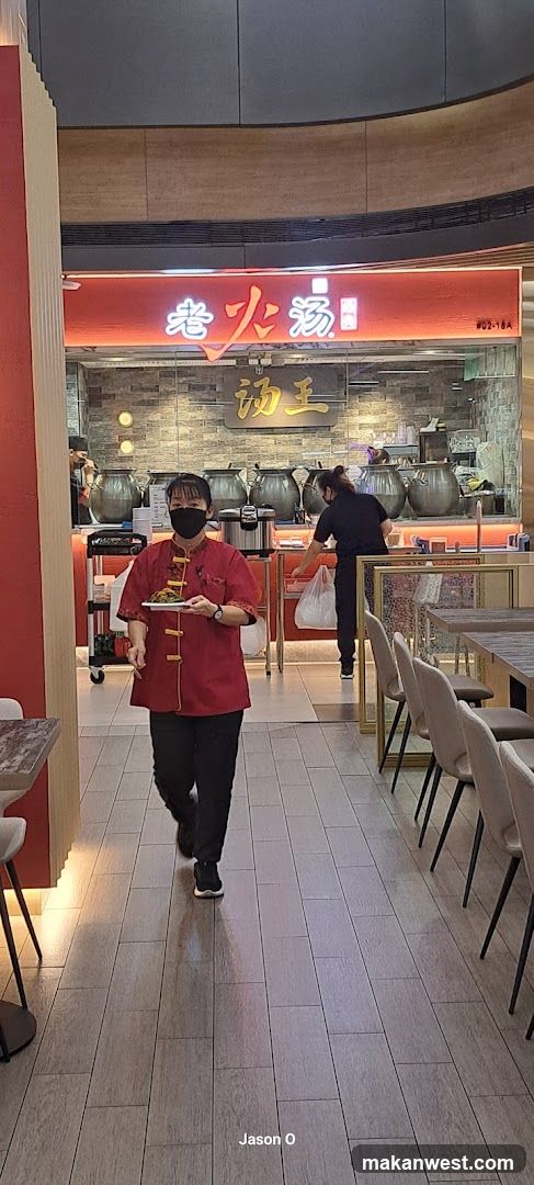 Staff carrying tray in restaurant interior