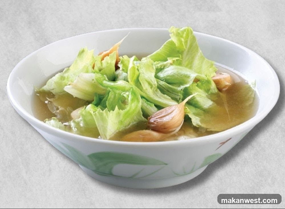 Bowl of Broccoli Soup with Garlic and Lettuce