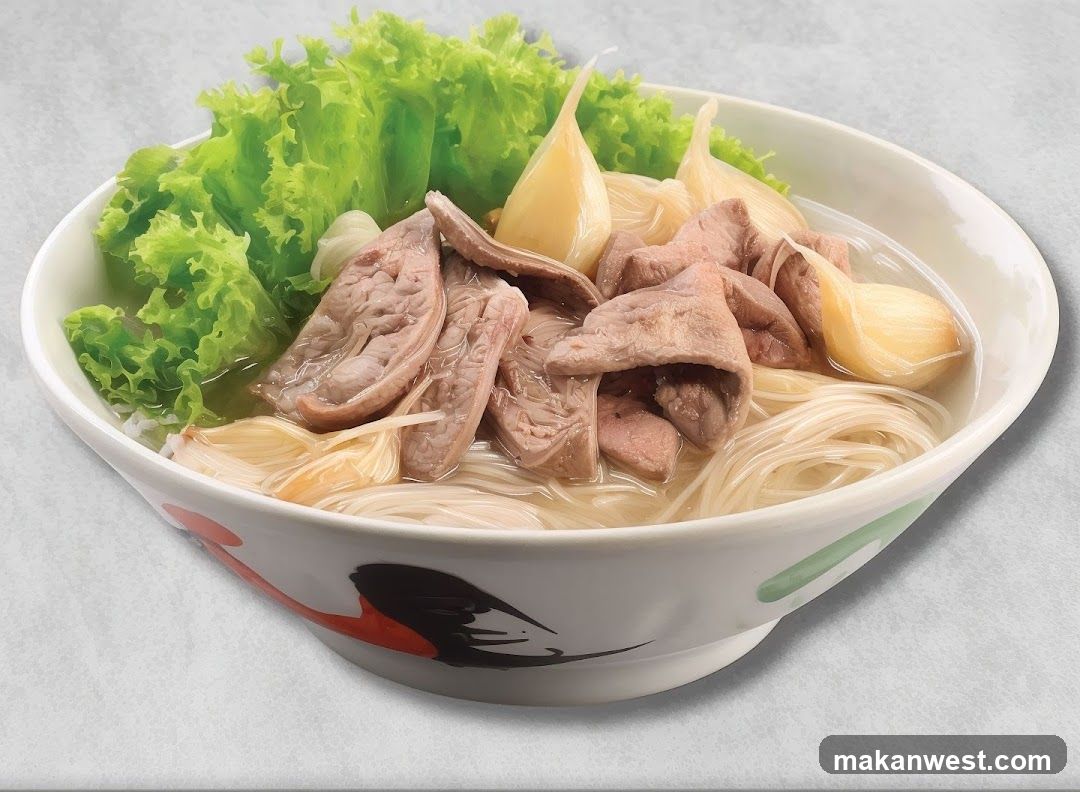 Bowl of Noodle Soup with Meat and Lettuce