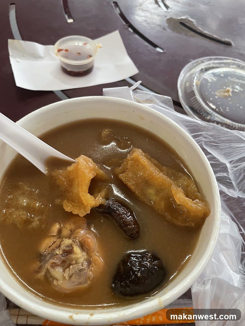 Bowl of Soup with Dumplings and Meat