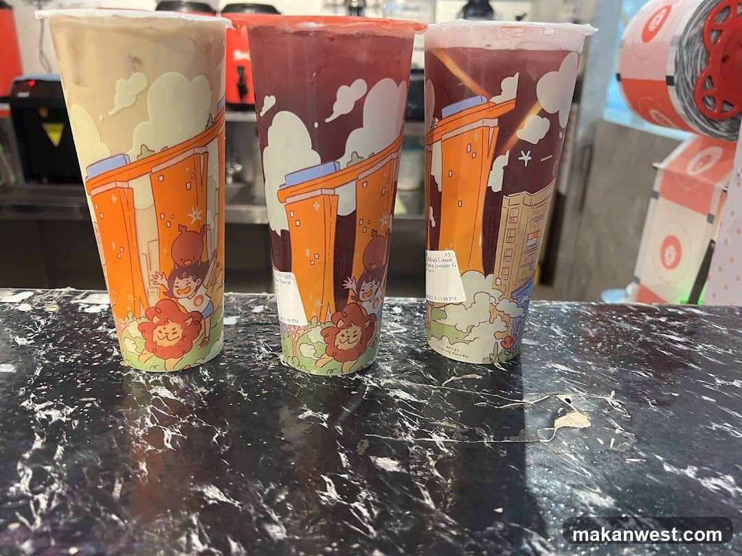 Three illustrated bubble tea cups on a marble counter