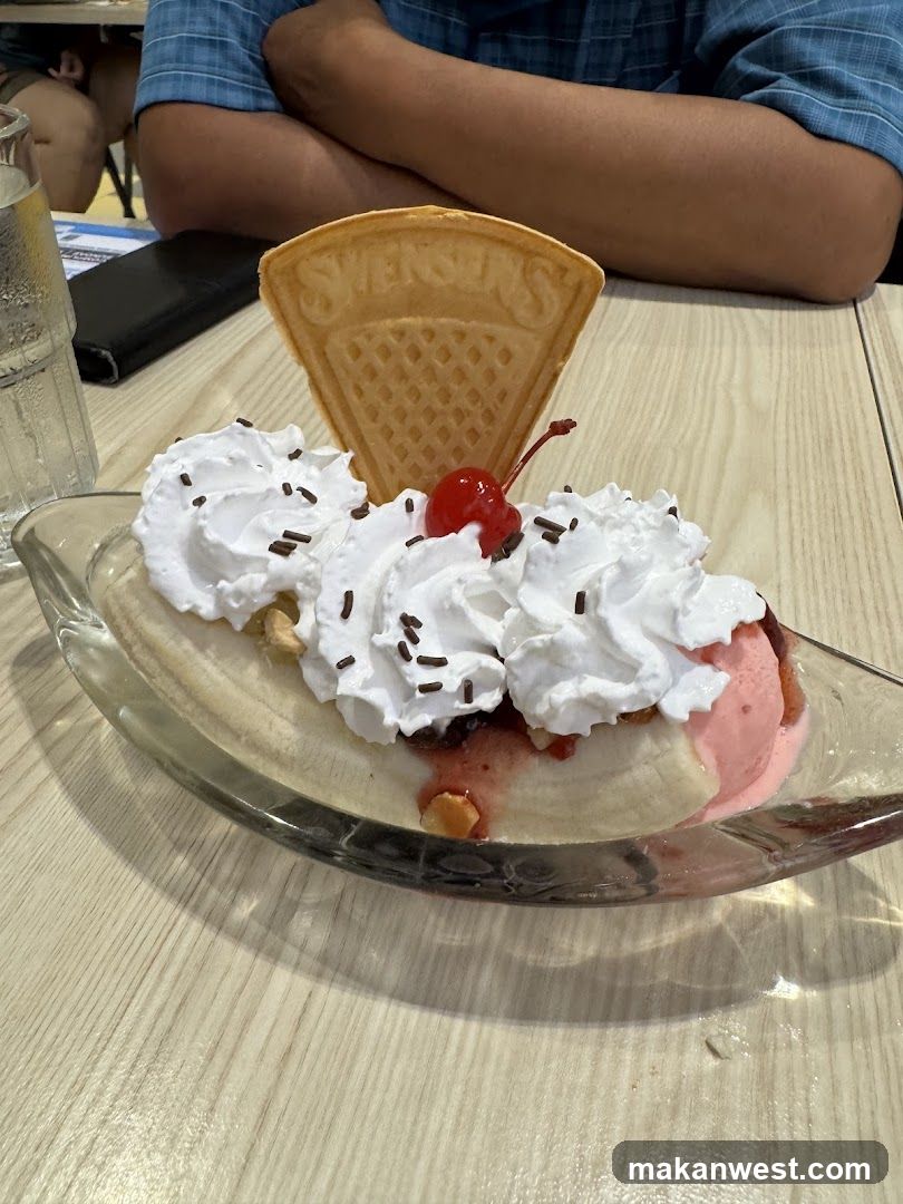 Banana Split with Whipped Cream and Cherry