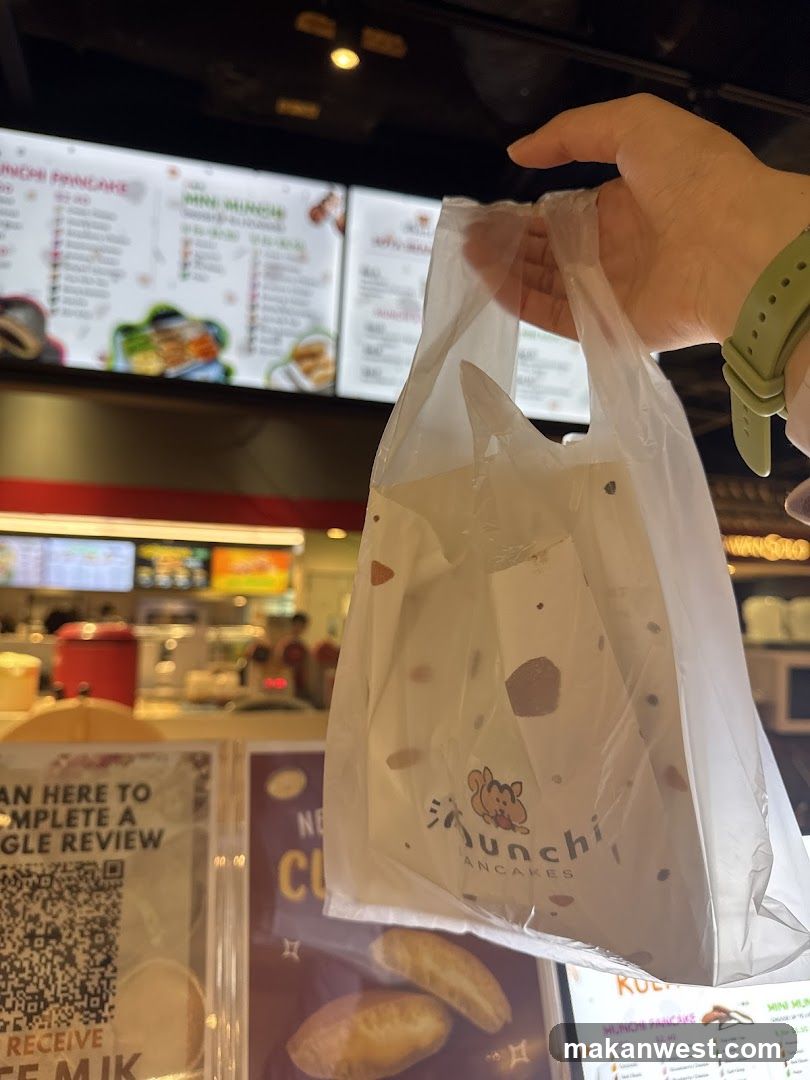 Food bag in hand at food court