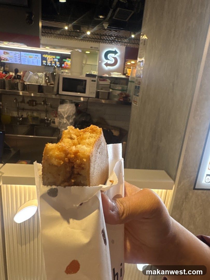 Food Item in Hand with Store Interior Background