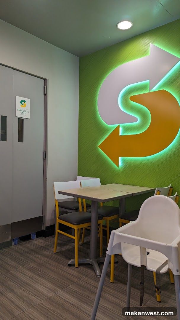 Interior seating area with branded wall art
