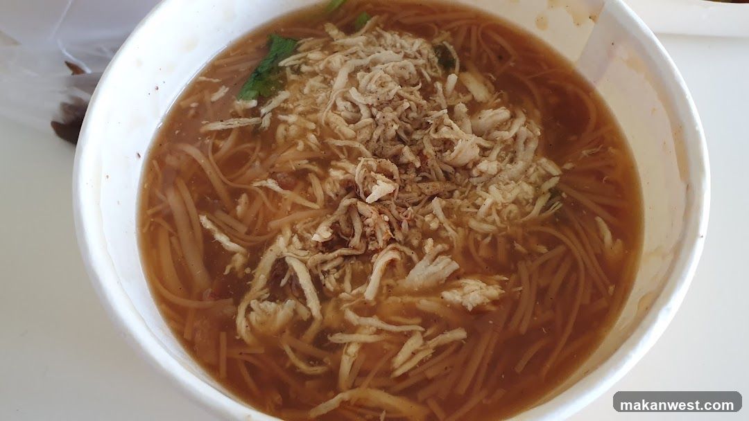 Bowl of Noodle Soup with Shredded Chicken