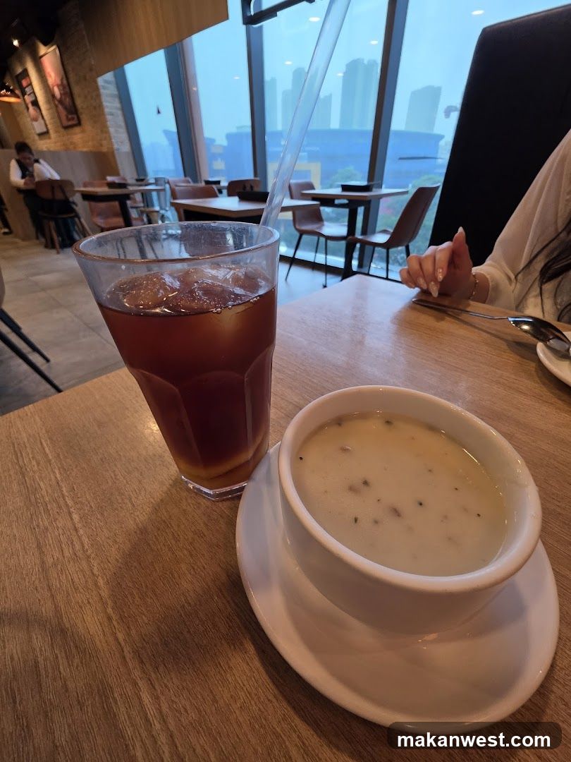 Dining Scene with Soup and Iced Tea