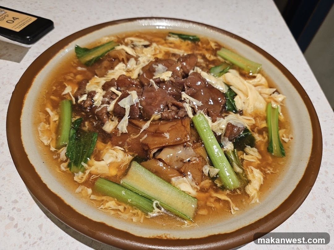 Bowl of Beef and Egg Soup with Greens