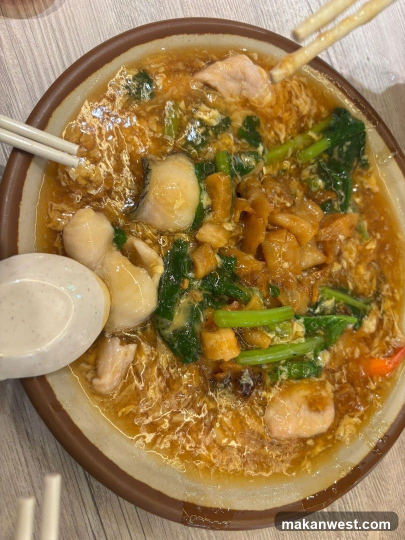 Bowl of Noodle Soup with Seafood and Vegetables