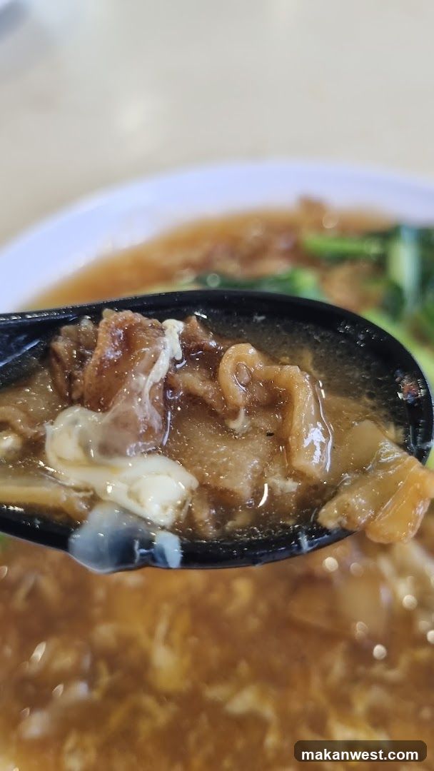 Spoonful of Soup with Meat and Egg