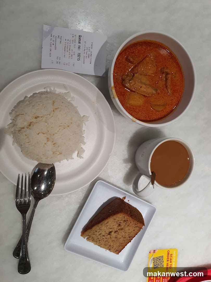 Meal Spread with Curry and Cake