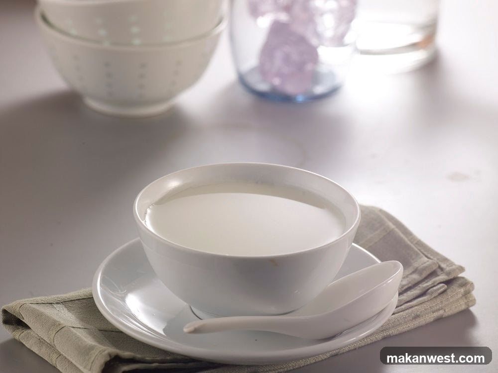 Bowl of Milk with Spoon