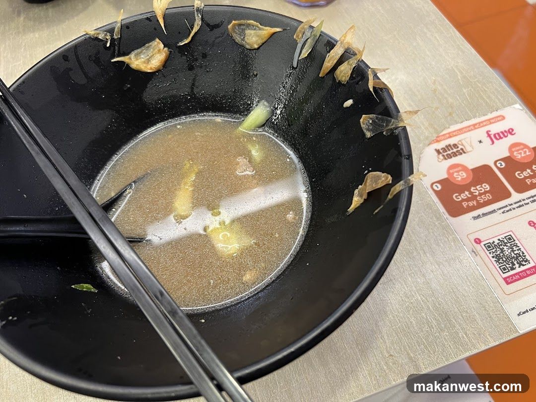 Bowl of soup with dried fish garnish