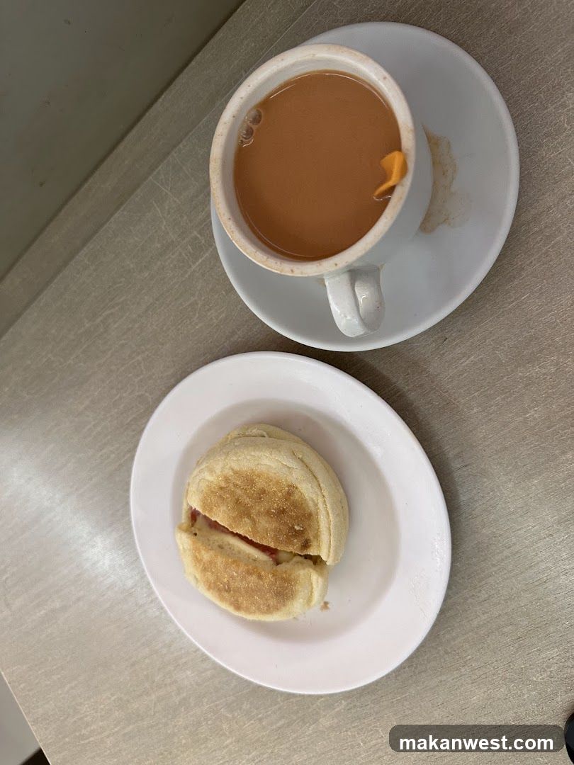 Breakfast with Tea and English Muffin Sandwich