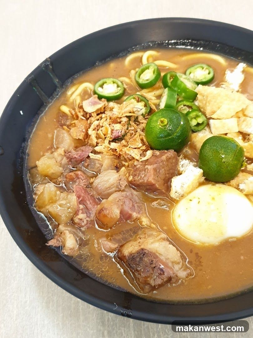 Bowl of Noodle Soup with Meat and Lime
