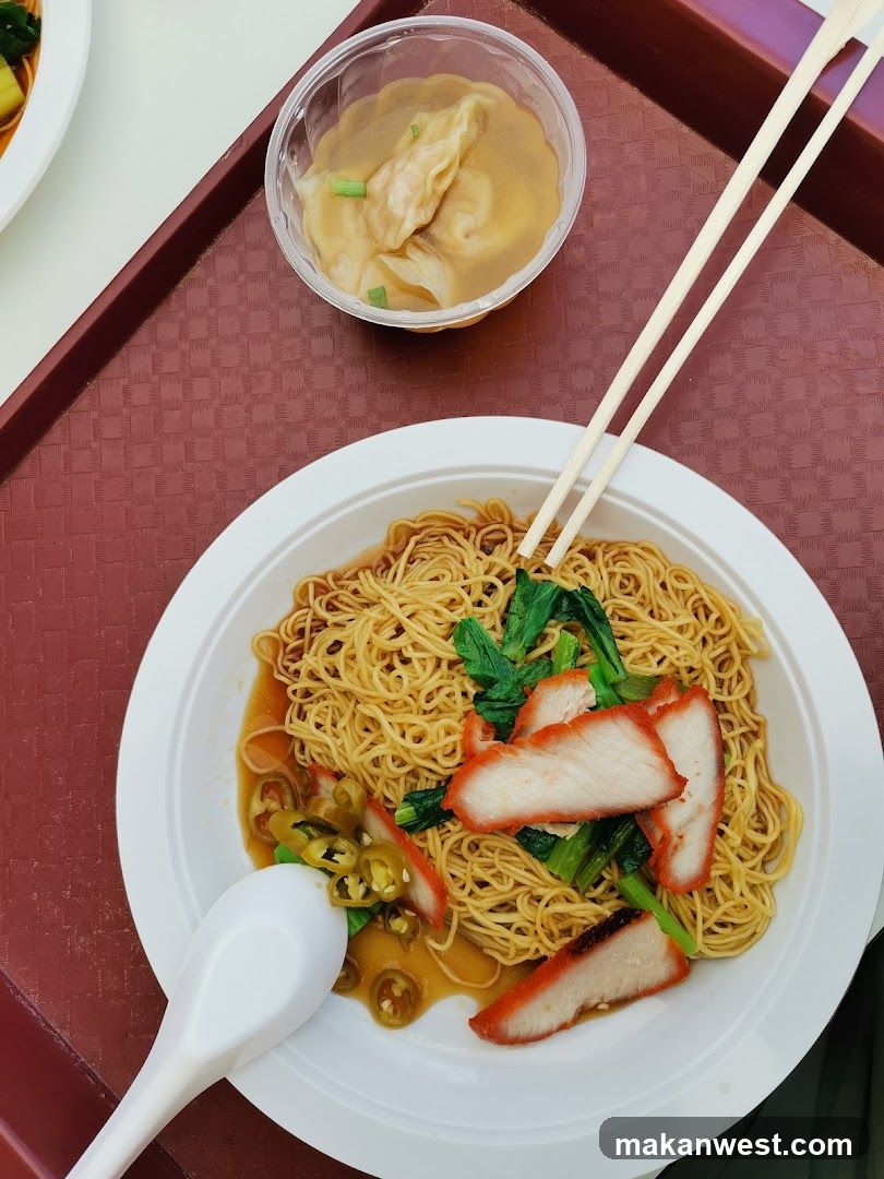 Noodle Dish with Chopsticks and Spoon