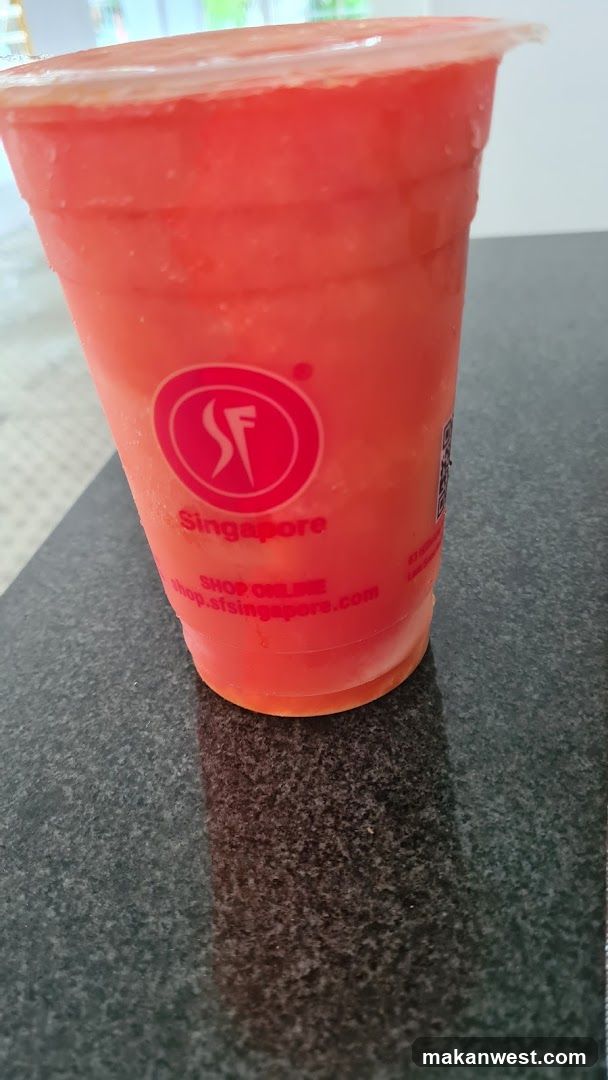 Red beverage in branded cup