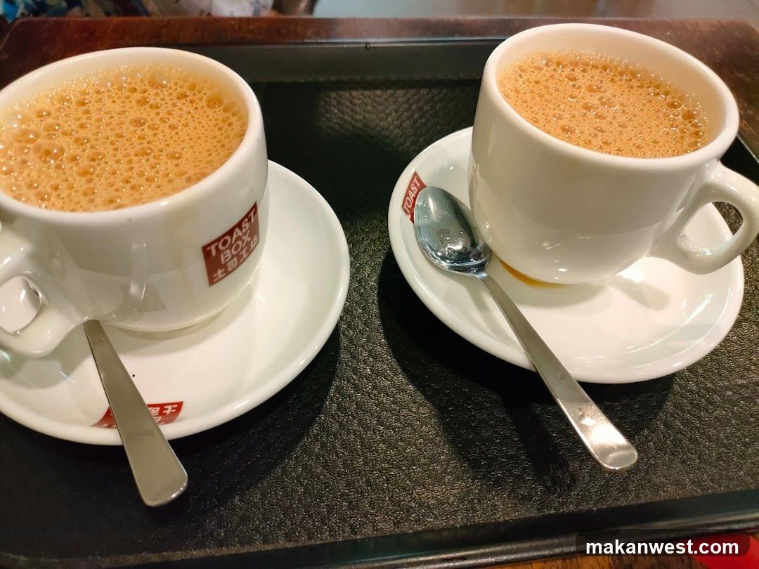 Two cups of coffee on a tray